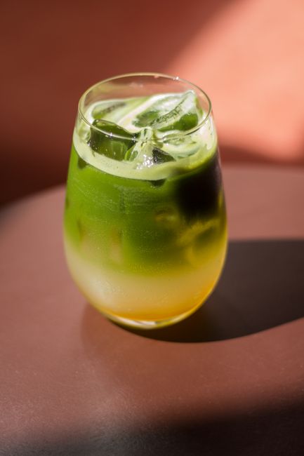 Inviting iced matcha latte with vibrant layers, perfect for a refreshing beverage treat.